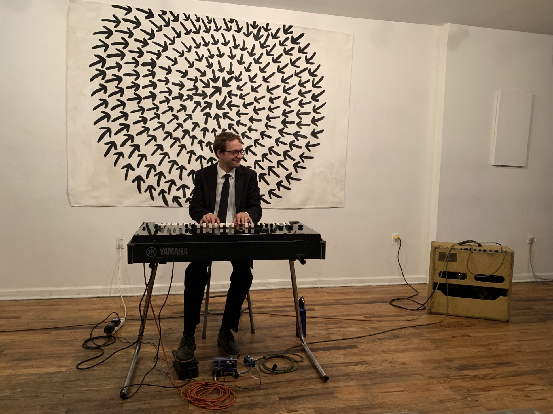 Organist in art gallery. 